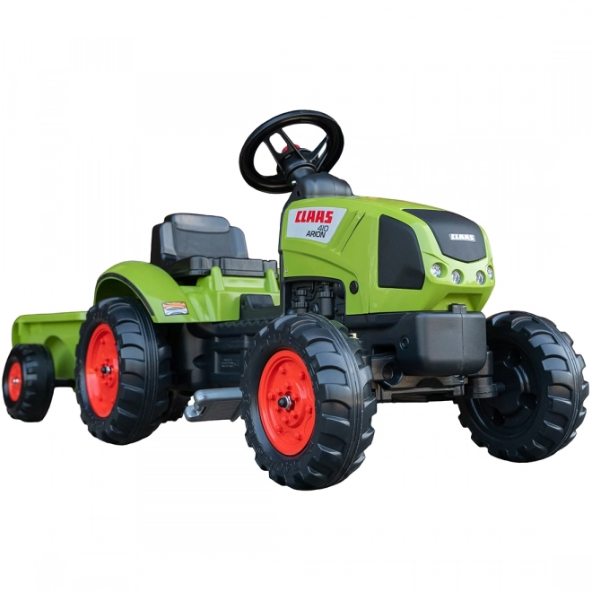 Trappertractor Claas Arion 410 met groene aanhanger