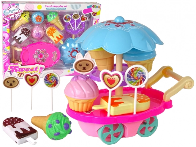 Kinderkraampje met speelgoed - ijscokar