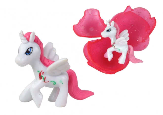 Magisch knappend ei Eenhoorn roze 6 cm