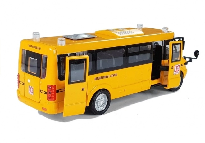 Metalen schoolbus met opwindmotor