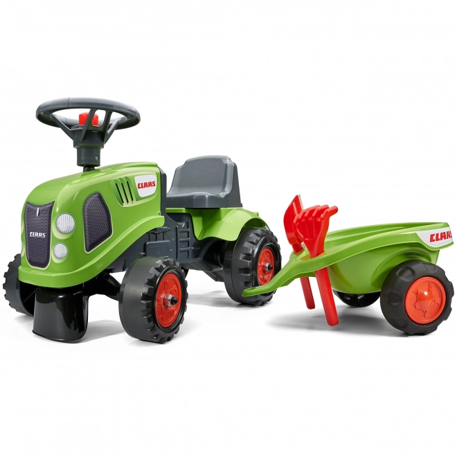 Duwtractor Claas groen met stuur en aanhanger