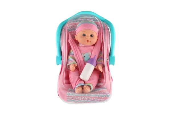 Poppen baby 30 cm plastic in draagzak/autostoeltje met flesje in blister