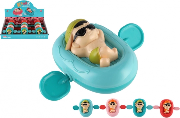 Opwindbaar poppetje op ligbed voor in het water, kunststof, 13 × 9 cm, 4 kleuren
