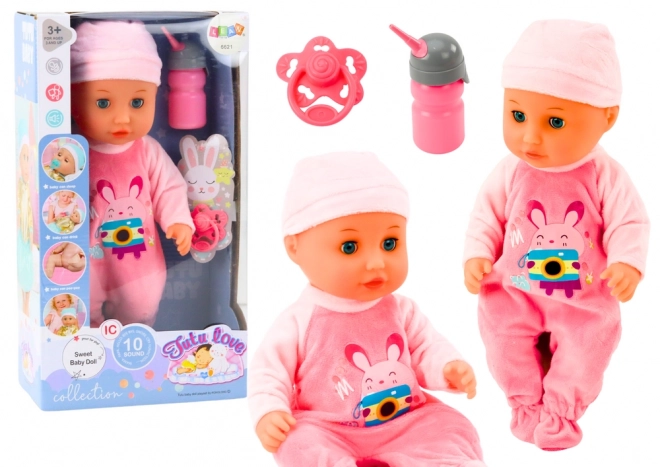 Baby pop met roze kleding en geluidseffecten