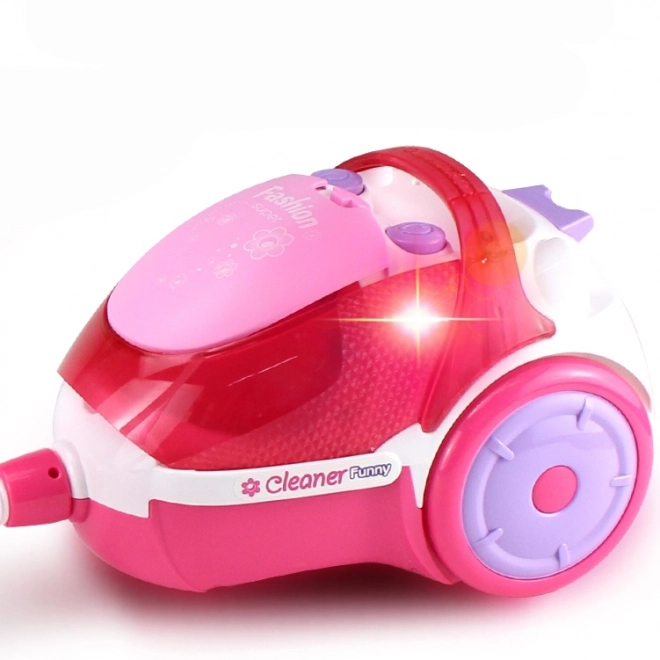 Roze kinderstofzuiger met zuigfunctie