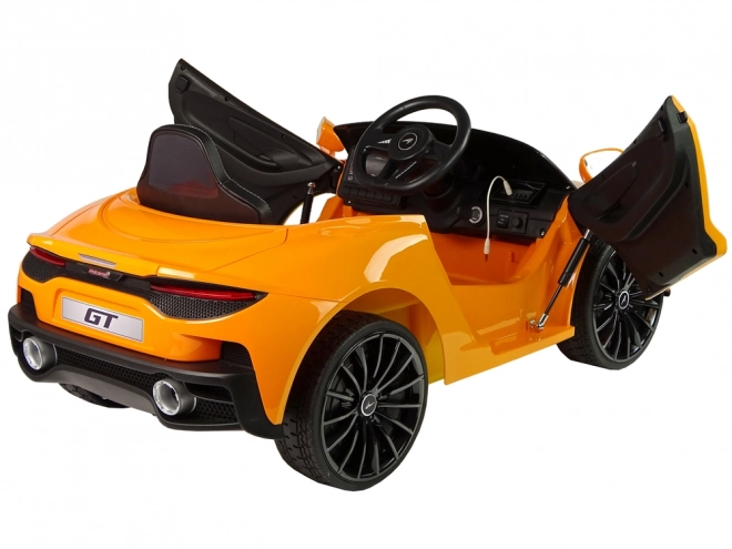 Kinderen batterijauto McLaren GT oranje