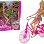 Pop op een roze fiets