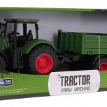 Groene tractor met aanhanger