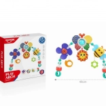 Speelboog voor kinderwagen en wipstoeltje met rammelaar