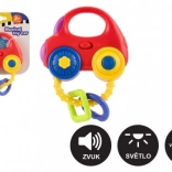 Rammelaar in de vorm van een auto met licht en geluid, kunststof, 10 × 11 cm, op batterijen, 3m+