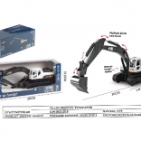Metalen witte graafmachine op rupsbanden