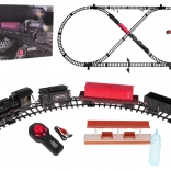 Treinbaan met rokende locomotief, licht en geluid