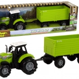 Groene landbouwtractor met aanhanger