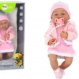 Babypop met accessoires in het roze
